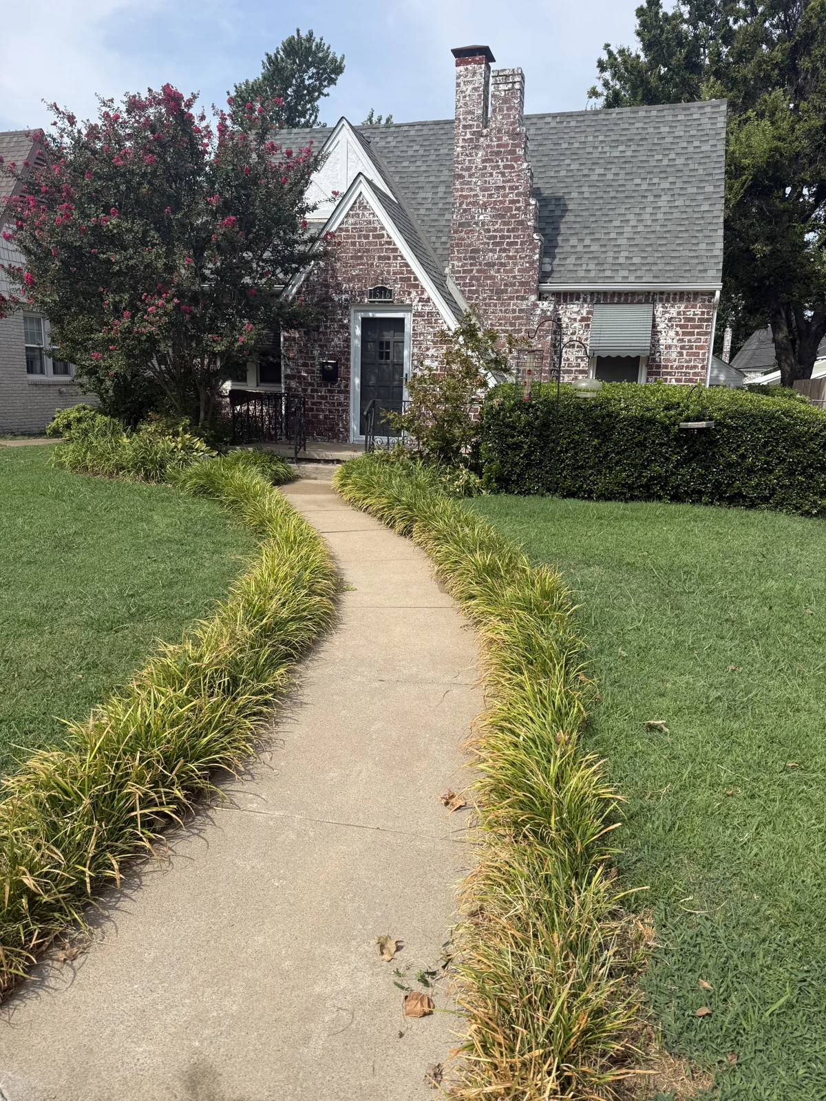 Brick cottage and its freshly cleaned front walk