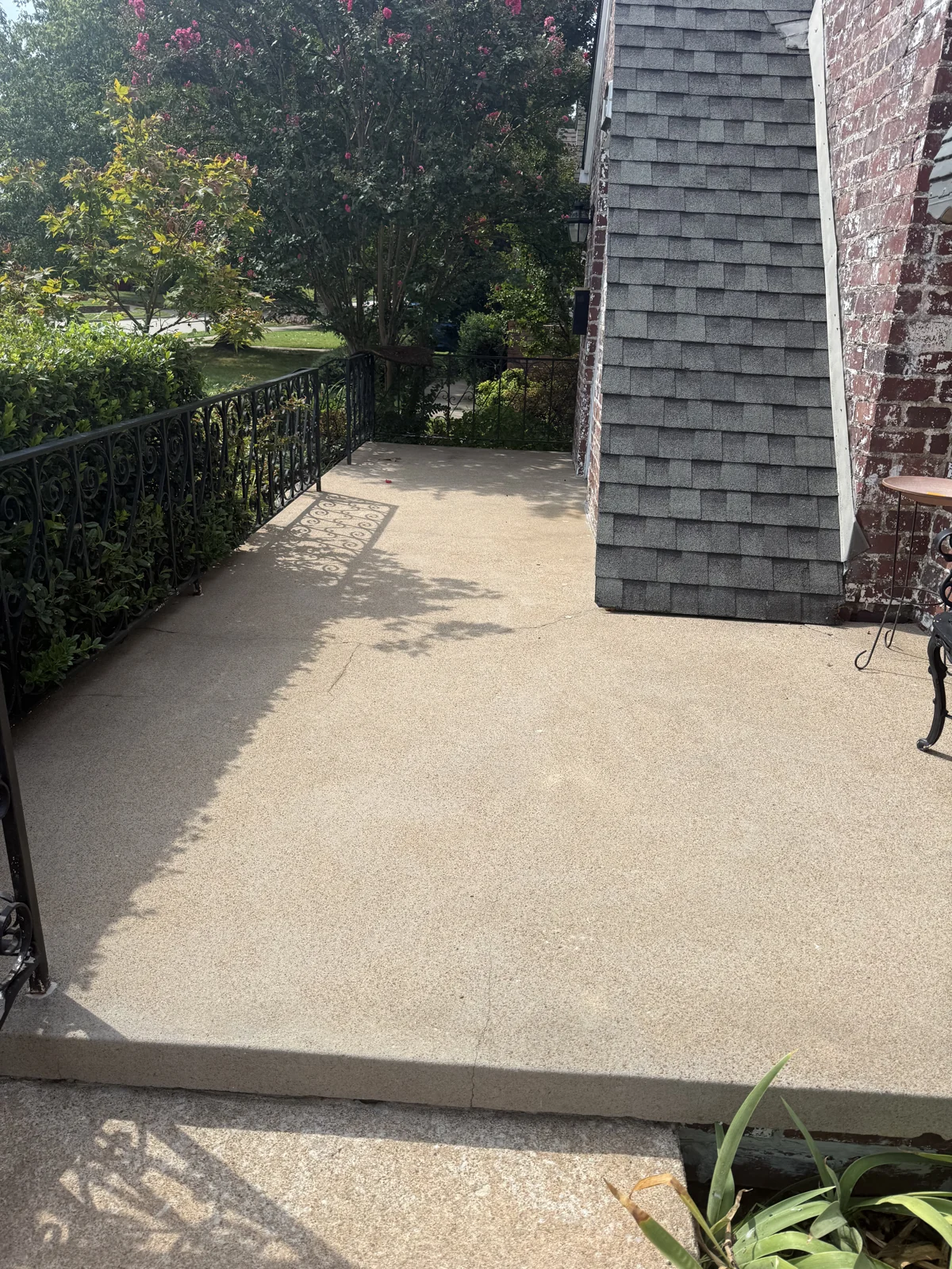 After: the same porch cleaned by Elite