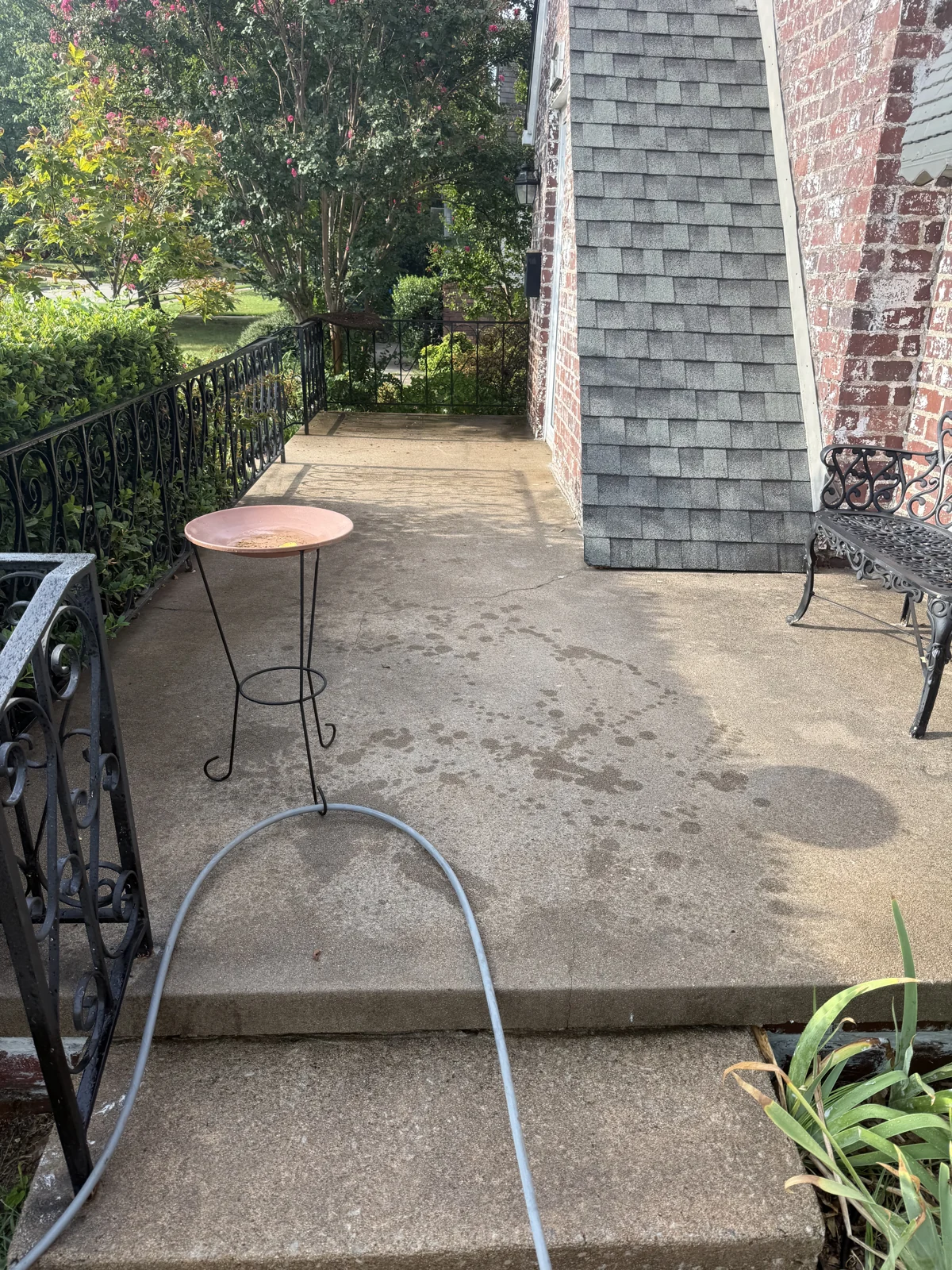 Before: weathered, dirty residential porch
