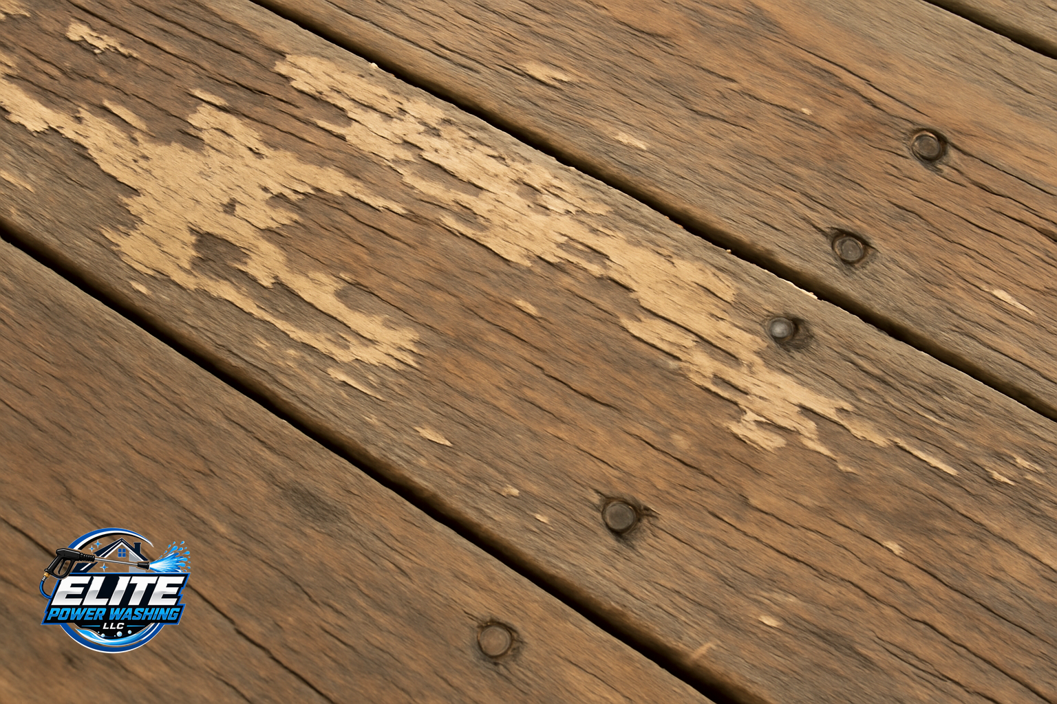Close-up of weathered deck boards showing peeling finish and worn areas.